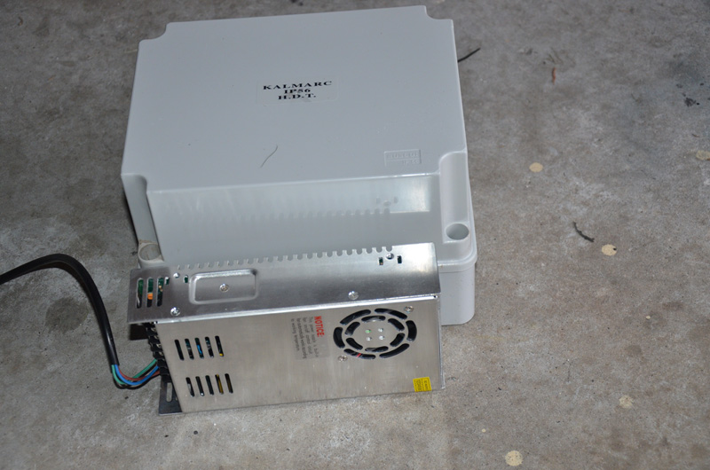 This shows the height of the box and lid compared with a PSU on its side