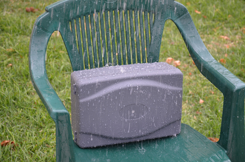 A sprinkler was hung from the clothes line above to rain what would be a moderate rainfall down on the box for 10 minutes. The box was sitting up to allow any water to drain away from below it, so no water got in through the cable entry below.