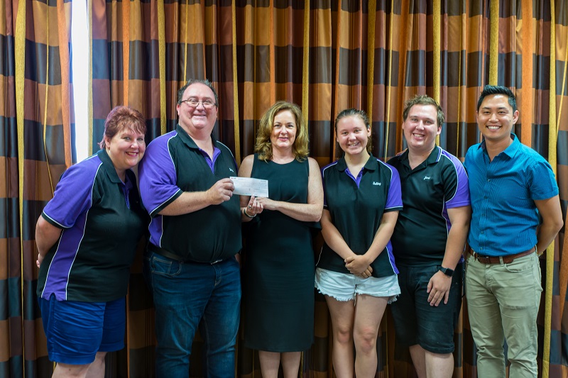 The LithgowLights crew present the cheque to Redkite CEO Jenny Seaton