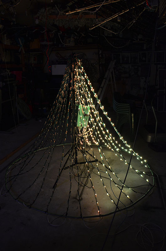 In order to test the modified rose garden setup, a rough mockup was completed in the shed and run through its paces. This upgrade will increase the lights from 12 vertical strings up to 32 strings making it look much fuller this year. The lights were modified from damaged Stellascapes ones used in the trees in previous years