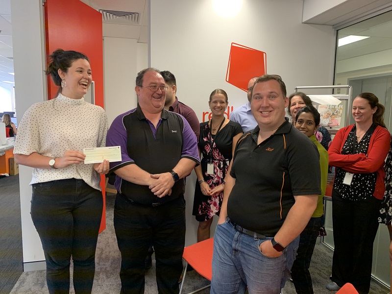 Handing over the $2500 to Redkite for our fundraising in 2019